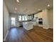 Beautiful kitchen with a large center island, stainless steel appliances, and modern lighting fixtures at 802 Hillfarm Dr, Wake Forest, NC 27587