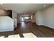 Spacious living room showcasing hardwood floors that extend to the open-concept kitchen area at 802 Hillfarm Dr, Wake Forest, NC 27587
