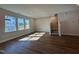 Bright living room with hardwood floors, recessed lighting, and large windows allowing for abundant natural light at 802 Hillfarm Dr, Wake Forest, NC 27587