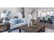 Comfortable living room featuring a sofa, coffee table, and seamless flow into the dining and kitchen area at 802 Hillfarm Dr, Wake Forest, NC 27587