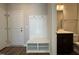 Mudroom area includes built-in bench with storage and coat hooks, and a nearby powder room at 802 Hillfarm Dr, Wake Forest, NC 27587