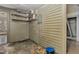 Unfinished basement with shelves, siding, and an electrical panel in need of repair at 922 Nashville Rd, Rocky Mount, NC 27803