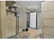 Unfinished basement with shelves, siding, and an electrical panel in need of repair at 922 Nashville Rd, Rocky Mount, NC 27803