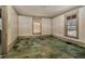 Unfurnished room with original trim and two windows provides a blank canvas for customization at 922 Nashville Rd, Rocky Mount, NC 27803