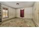 Empty bedroom showcasing natural light, built-in shelving, and original trim at 922 Nashville Rd, Rocky Mount, NC 27803