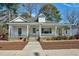 Inviting home featuring a covered porch, providing a relaxing outdoor space and classic curb appeal at 922 Nashville Rd, Rocky Mount, NC 27803