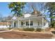 Classic house with a spacious covered porch, prominent columns, and surrounded by lush greenery at 922 Nashville Rd, Rocky Mount, NC 27803