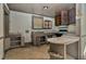 The kitchen with outdated cabinets and lots of space has great potential for remodeling at 922 Nashville Rd, Rocky Mount, NC 27803