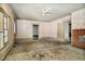 Bright living room with a ceiling fan, and brick fireplace, offering potential for a cozy atmosphere at 922 Nashville Rd, Rocky Mount, NC 27803
