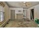 This empty room features original trim, a fireplace, and lots of natural light at 922 Nashville Rd, Rocky Mount, NC 27803