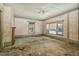 Open living room space featuring large windows for natural light and a brick fireplace at 922 Nashville Rd, Rocky Mount, NC 27803