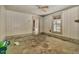 This unfinished room featuring natural light and original wood trim is ready for renovation at 922 Nashville Rd, Rocky Mount, NC 27803