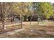 Property featuring wooden sheds and a fenced area, providing ample storage and space at 10004 Liana Ln, Raleigh, NC 27613