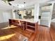 Kitchen boasts stainless steel appliances, custom cabinets, granite countertops, and hardwood floors at 10004 Liana Ln, Raleigh, NC 27613