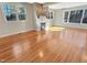 Living room featuring stone fireplace, recessed lighting, hardwood floors, and natural light at 10004 Liana Ln, Raleigh, NC 27613