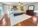Spacious main bedroom featuring hardwood floors, ceiling fan, and ensuite bathroom with glass shower at 10004 Liana Ln, Raleigh, NC 27613