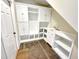 Mud room boasts custom built-ins, tiled floor, sink, and cabinet storage at 10004 Liana Ln, Raleigh, NC 27613
