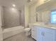 Bathroom featuring tub-shower combo with white cabinets and countertop at 10018 Secluded Garden Drive Rd # 187, Apex, NC 27523