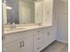 Bathroom with double sink vanity, large mirror and tiled shower at 10018 Secluded Garden Drive Rd # 187, Apex, NC 27523