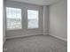 Well lit bedroom with two windows at 10018 Secluded Garden Drive Rd # 187, Apex, NC 27523