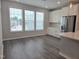 Bright kitchen with stainless steel appliances, white cabinets, a backsplash, and plenty of natural light at 10018 Secluded Garden Drive Rd # 187, Apex, NC 27523