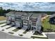 Aerial view of new townhomes with sidewalks, manicured lawns, and well-planned community layout at 10020 Secluded Garden Drive Rd # 188, Apex, NC 27523