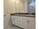 Modern bathroom features double vanity sinks, stylish fixtures, and a tiled shower at 10020 Secluded Garden Drive Rd # 188, Apex, NC 27523