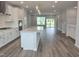 Bright, open-concept kitchen boasts a large island, stainless steel appliances, and modern finishes at 10020 Secluded Garden Drive Rd # 188, Apex, NC 27523