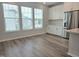 Eat-in kitchen featuring stainless steel appliances, ample cabinet space, and abundant natural light at 10020 Secluded Garden Drive Rd # 188, Apex, NC 27523