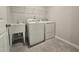 Efficient laundry room with modern washer, dryer, and utility sink for convenience at 10020 Secluded Garden Drive Rd # 188, Apex, NC 27523