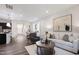 Bright open-concept living area with modern décor, hardwood floors, and white sofa at 1003 Red Roses Ave, Durham, NC 27703