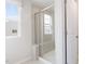 Bathroom with a walk-in shower featuring glass doors and a built-in bench at 1003 Red Roses Ave, Durham, NC 27703