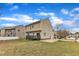 Backyard of home with a spacious lawn, wood deck, and neighboring properties at 102 Switchback St, Knightdale, NC 27545