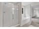 Shower and bathtub area in a bathroom with a framed glass shower door at 102 Switchback St, Knightdale, NC 27545