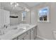 Well-lit bathroom with double vanity and a window providing natural light at 102 Switchback St, Knightdale, NC 27545