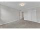 Bright bedroom with large closet doors and neutral carpeting at 102 Switchback St, Knightdale, NC 27545