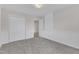 Bedroom with paneled walls, double closets and a carpeted floor at 102 Switchback St, Knightdale, NC 27545