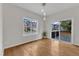 Bright dining room with hardwood floors, large windows, and access to the deck at 102 Switchback St, Knightdale, NC 27545
