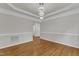 Spacious dining room featuring stylish lighting, decorative molding, and hardwood flooring at 102 Switchback St, Knightdale, NC 27545
