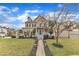 Charming two-story home featuring a landscaped front yard and inviting front porch at 102 Switchback St, Knightdale, NC 27545