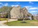 Attractive two-story home with mature trees, driveway, and manicured lawn at 102 Switchback St, Knightdale, NC 27545