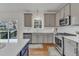 Beautiful kitchen with stainless steel appliances and an island with seating at 102 Switchback St, Knightdale, NC 27545