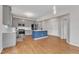 Spacious kitchen with stainless steel appliances, a center island, and hardwood floors at 102 Switchback St, Knightdale, NC 27545