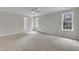 Spacious main bedroom with a ceiling fan and large windows providing lots of natural light at 102 Switchback St, Knightdale, NC 27545
