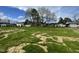 Large and expansive lot with lush green grass and scattered trees under a bright, cloudy sky at 103 Oakfield Trace Dr, Four Oaks, NC 27524