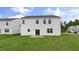 Expansive backyard with lush green grass and a concrete patio creates an inviting outdoor space at 104 Pisgah St, Sanford, NC 27330