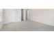 Spacious carpeted bedroom with white doors and neutral walls at 104 Pisgah St, Sanford, NC 27330
