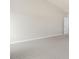 Neutral bedroom with vaulted ceiling, gray carpet, and crisp white door and trim at 104 Pisgah St, Sanford, NC 27330