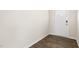Bright entryway featuring wood-look flooring and a white front door with window accents at 104 Pisgah St, Sanford, NC 27330
