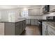 Well-lit kitchen with stainless appliances, granite island and eat in kitchen area at 104 Pisgah St, Sanford, NC 27330